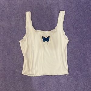 Simple white tank with butterfly design